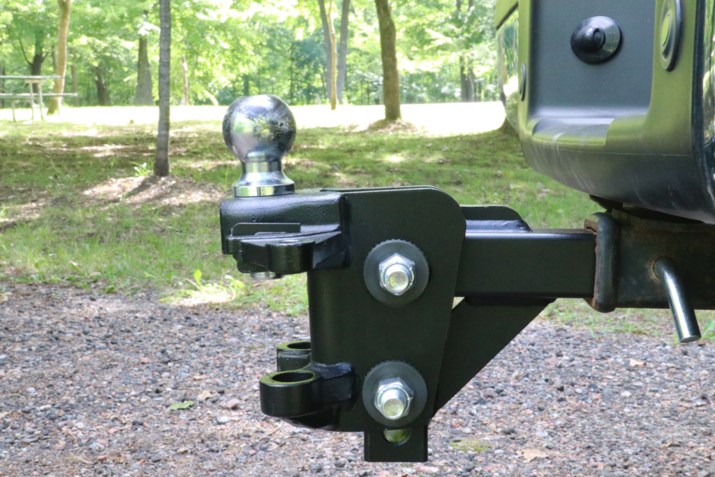 A custom trailer hitch for connecting a utility trailer to a truck.