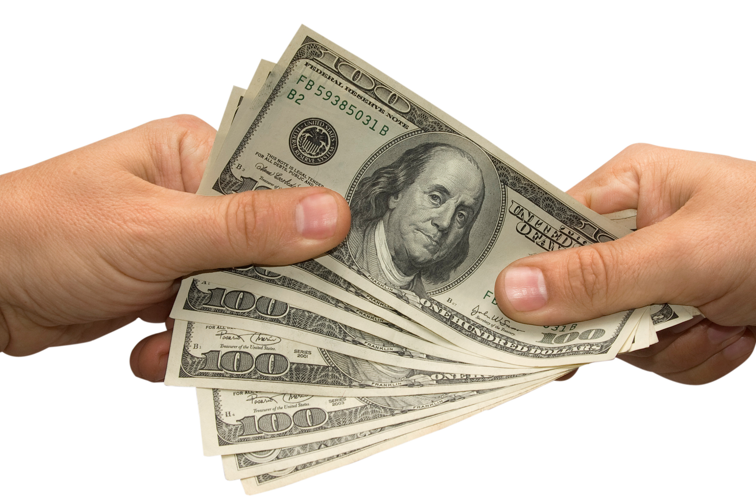 One person handing money to another. 